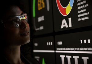 AI Using. Silhouetted analysts interact with a large AI data