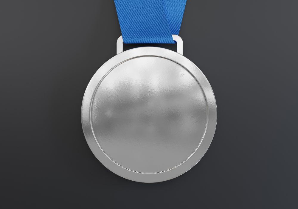 Silver medal against a black background